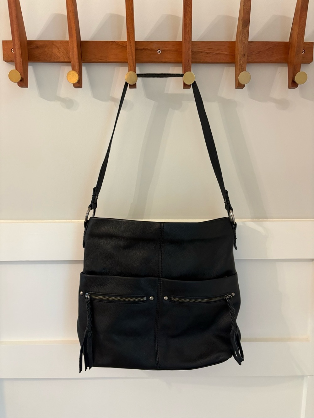 The Sak Black Leather Shoulder Bag with Front Zip Pockets